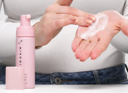 Hair Gain Scalp Foam formula in the palm of hand