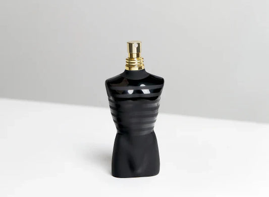 Bottle of Jean Paul Gaultier Le Male Le Parfumn on a white table